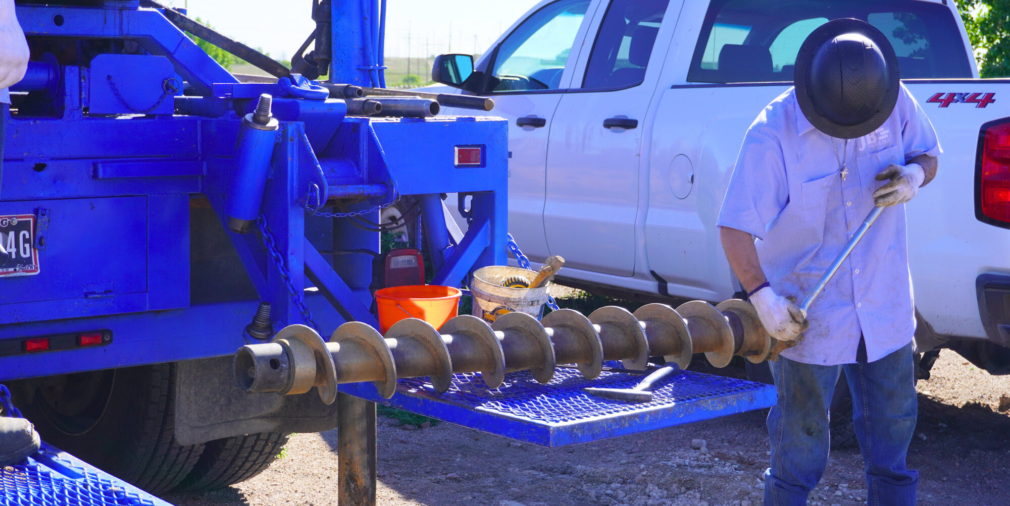 JB Drilling employee working with the drill